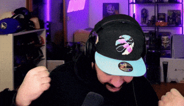 a man wearing headphones and a hat that says toronto raptors