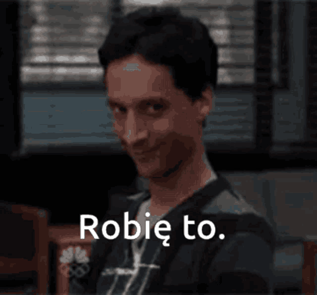 a man is smiling and the words robie to are above him