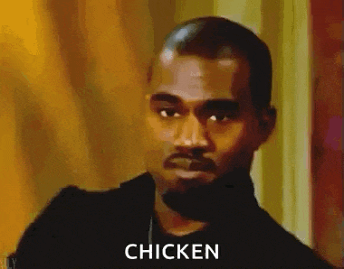 a close up of a man 's face with the words `` chicken '' written on it .