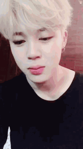 a close up of a person with blonde hair