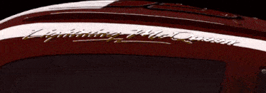 a close up of a red race car with a lightning bolt on the side .