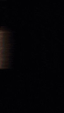 a blurred image of a person 's face with a black background and a few lines visible