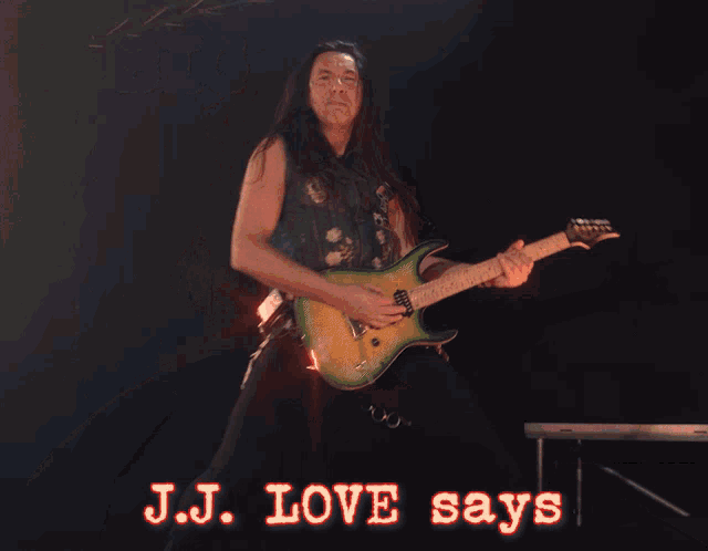 a man playing a guitar with the words big love written above him