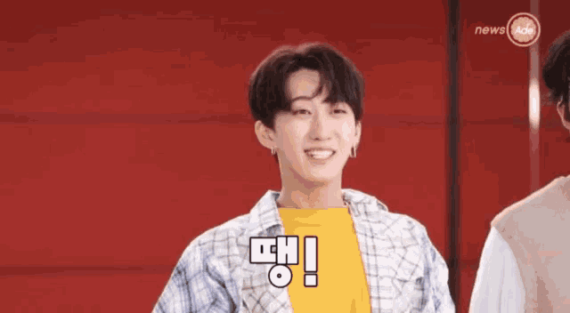a group of young men are standing next to each other and one of them is saying random noises by changbin .