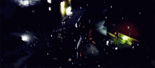 a close up of a person 's hand in a dark room with a lot of lights .