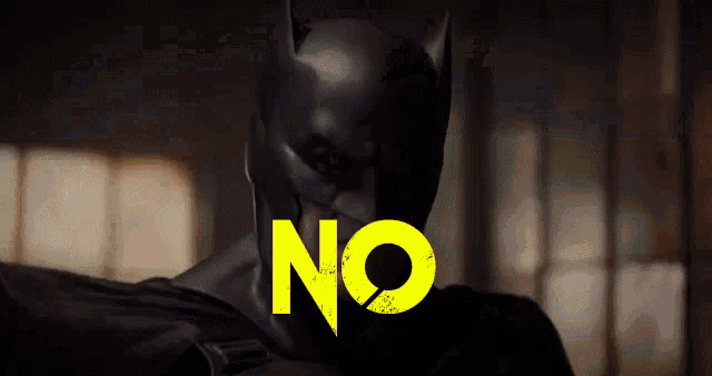 a close up of a batman mask with the word no in yellow letters