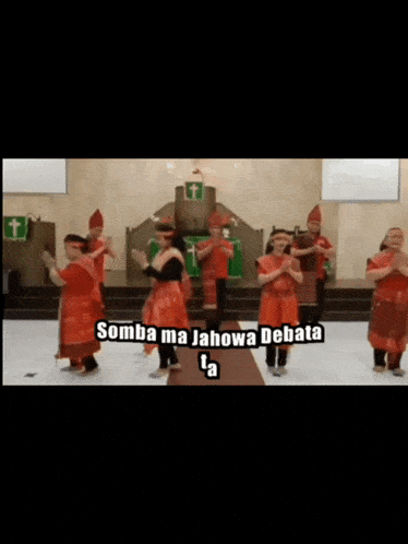 a group of people are dancing in a church and the words somba ma jahowa debata are on the screen