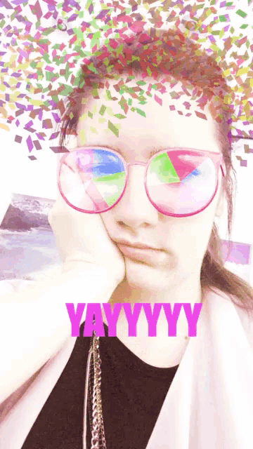 a woman wearing glasses with the word yayyyy written on it