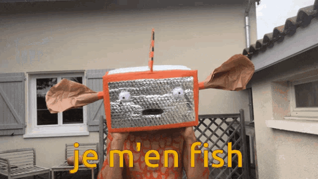 a person with a box on their head that says je m 'en fish on it