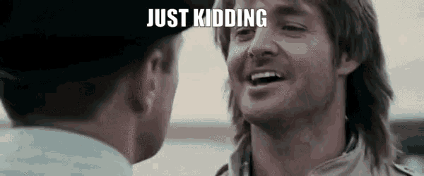a man with a mullet is talking to a police officer and smiling .