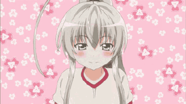 a girl in a white shirt with a red stripe on the sleeve is surrounded by pink hearts