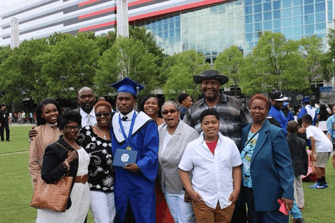a group of people posing for a picture with a graduate