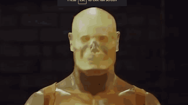 a statue of a man with a skull on his face is displayed on a screen