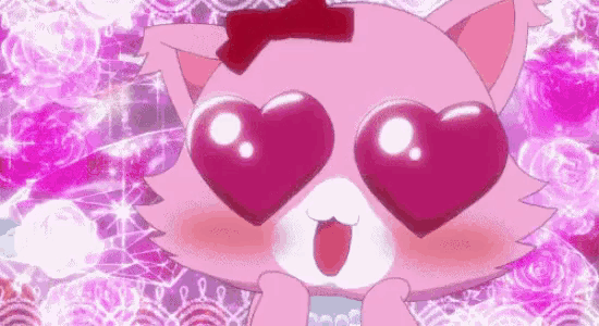 a pink cat with heart shaped eyes and a red bow on its head .
