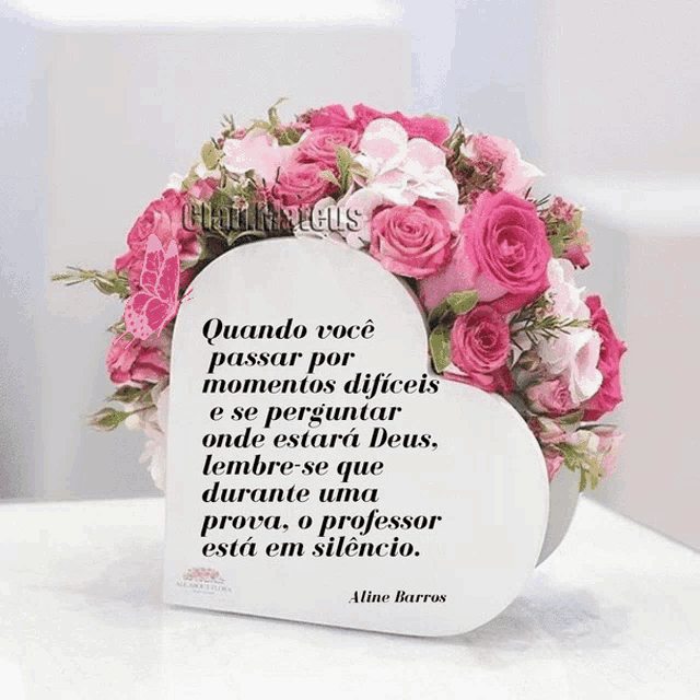 a heart shaped box with pink roses and a quote by aline barros