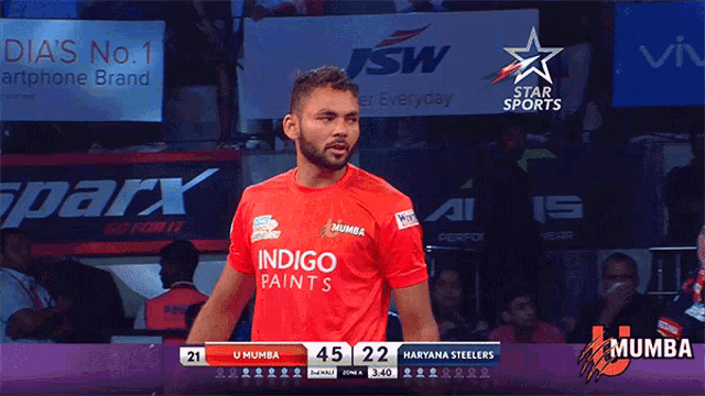 a man wearing a red indigo paints shirt