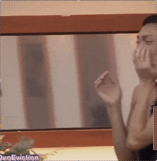 a woman covering her face with her hands in front of a mirror with the words " duoeviction " on the bottom right