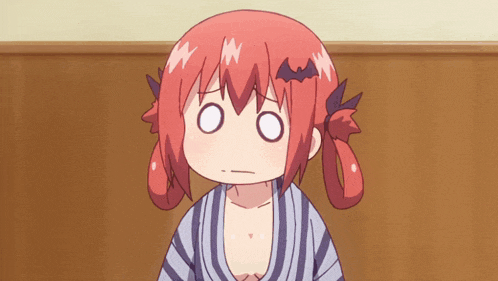 a girl with red hair and a bat on her head is making a funny face