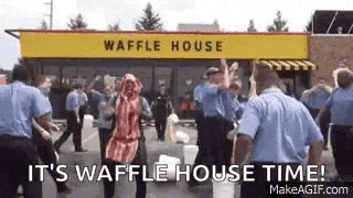 a group of people are dancing outside of a waffle house .