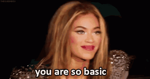 a close up of a woman 's face with the words `` you are so basic '' on it .