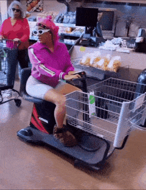a woman is riding a scooter in a store