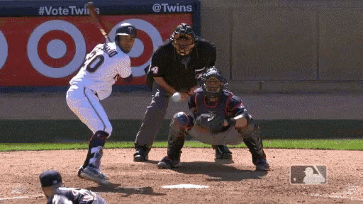 a baseball player with the number 10 on his jersey swings his bat
