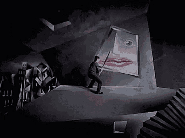 a man is standing in front of a painting of a woman 's face with red lips .