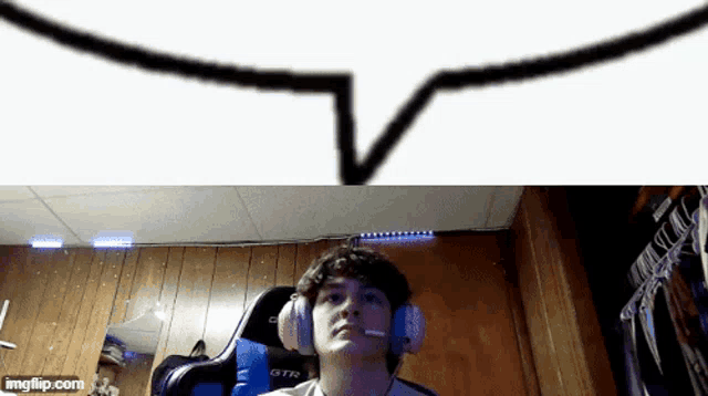 a boy wearing headphones and a gtr chair