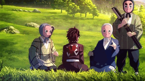 a group of people are sitting in a grassy field