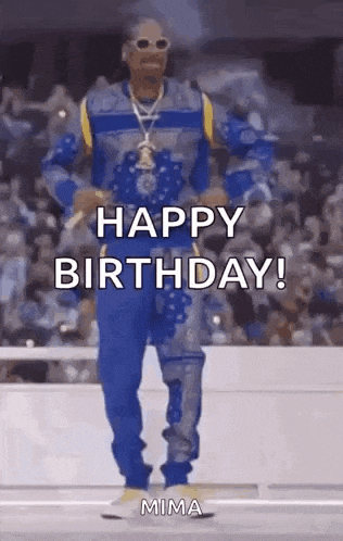 snoop dogg is dancing in front of a crowd while wearing a blue and yellow outfit .
