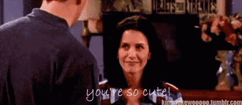 a man and a woman are looking at each other and the man says you 're so cute .
