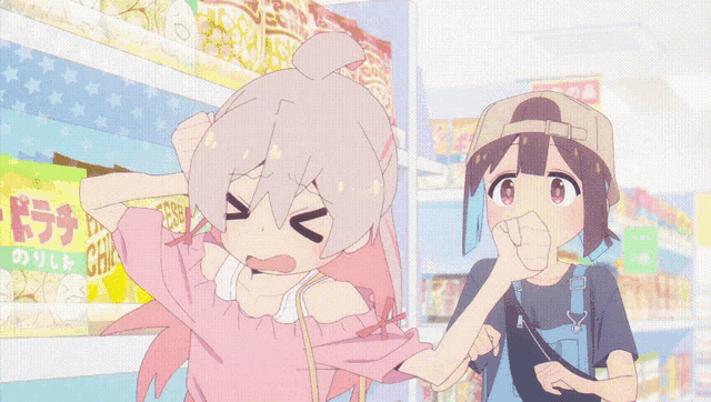 a girl in a pink shirt is standing next to a boy