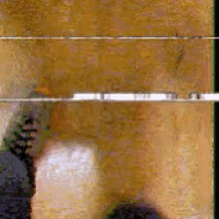 a blurry picture of a person standing in front of a window .