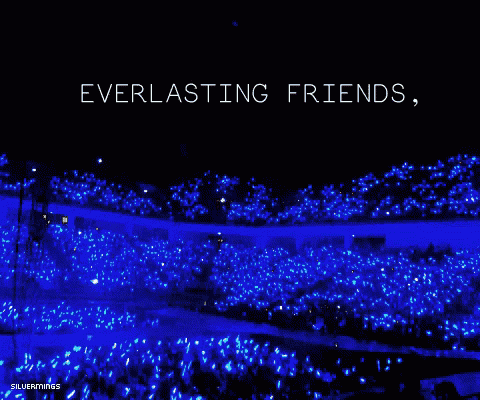 a crowd of people are gathered in a dark blue stadium with a quote that says it 's not an end everlasting friends