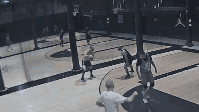 a man wearing a jersey that says '11 ' on it is playing basketball