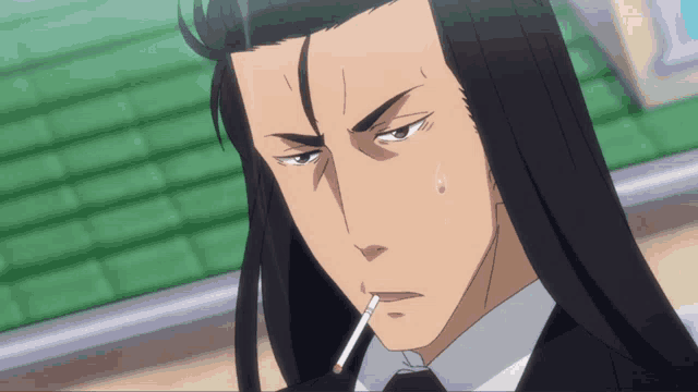 a man with long black hair is smoking a cigarette in his mouth