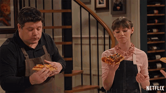 a man and a woman are eating pizza with netflix written on the bottom right