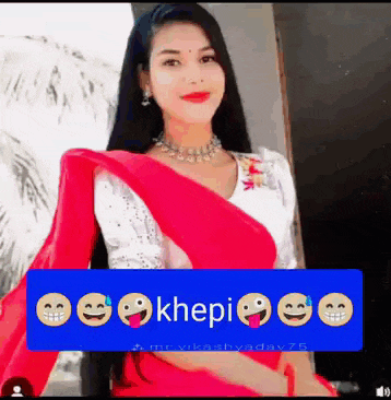 a woman in a red saree is standing in front of a sign that says khepi