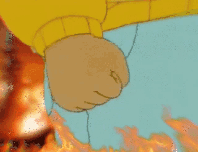 a close up of a cartoon character 's fist in front of a fire