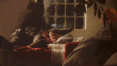a person is laying on a couch with a monster behind them