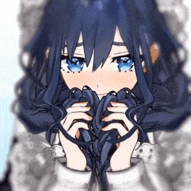 a girl with long black hair and blue eyes is holding a black object in her hands