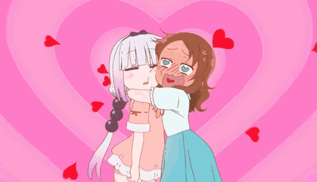 a girl with a beard kisses another girl in front of a heart shaped background