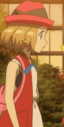 a girl is wearing a red hat and carrying a pink backpack