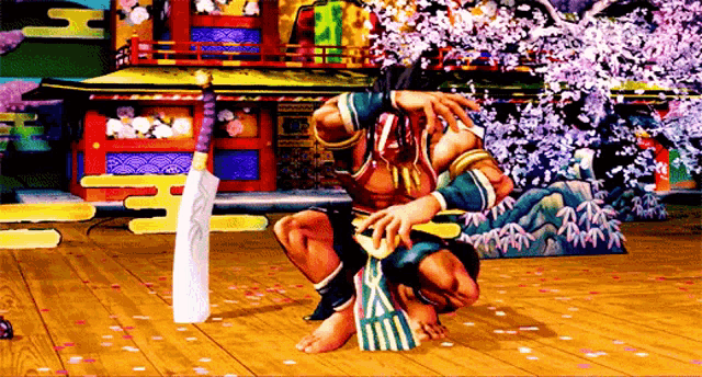 a man is squatting down with a sword in his hand