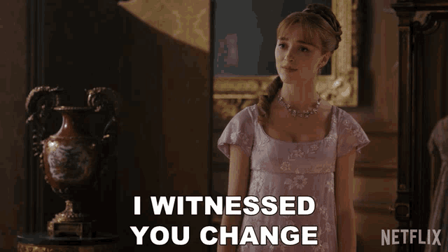 a woman in a purple dress says i witnessed you change in front of a vase