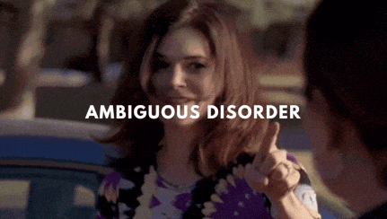 a woman with ambiguous disorder is giving a thumbs up to another woman .