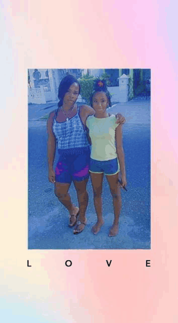 a woman and a little girl are posing for a picture together .