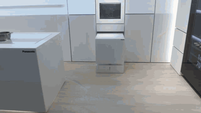 a panasonic appliance sits on the floor in a room