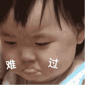 a baby with chinese writing on his face is making a face .