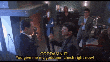 a group of people are gathered in a room and one of them says " goddamn it "